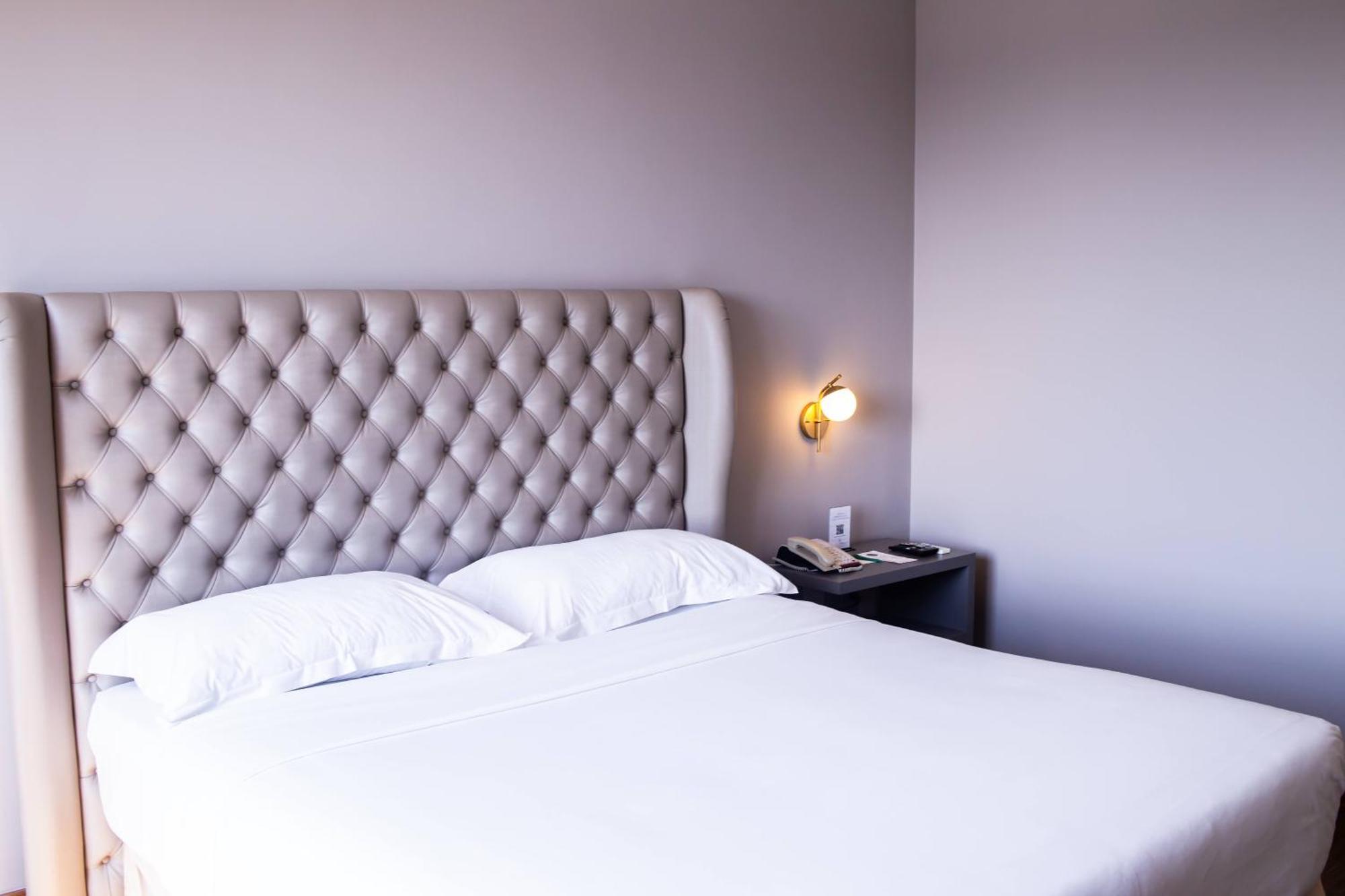 Ouro Minas Hotel Belo Horizonte, Dolce By Wyndham Kültér fotó A bedroom at the hotel